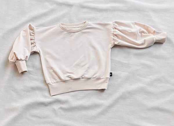 Neutraal sweater pofmouw