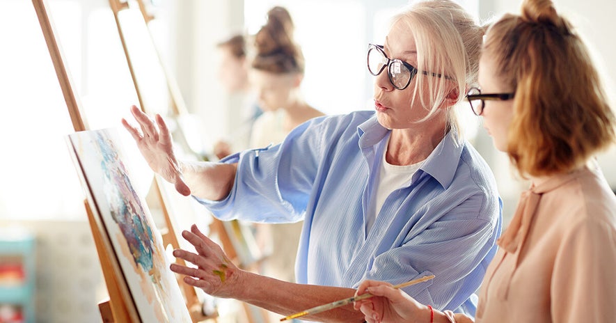 teacher, teaching art to a student