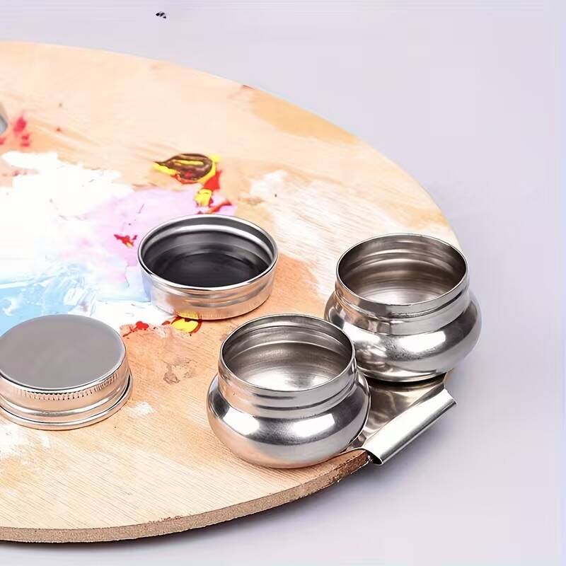 Stainless Steel Double Dipper, attached to a  colour palette