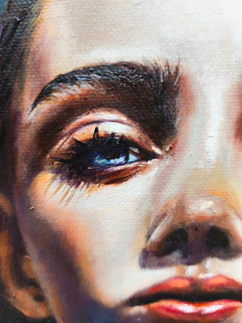 Part of a painting called Resilience. By Annalisa Mongio. featuring the eye and nose of a woman