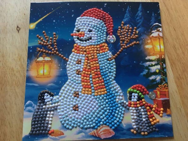 Sneeuwman met pinguïns