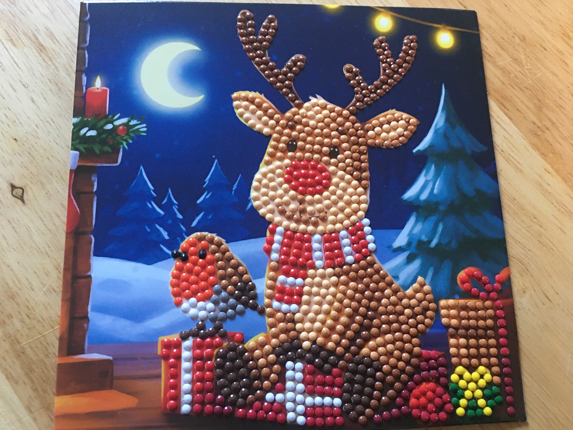 Rendier met roodborstje