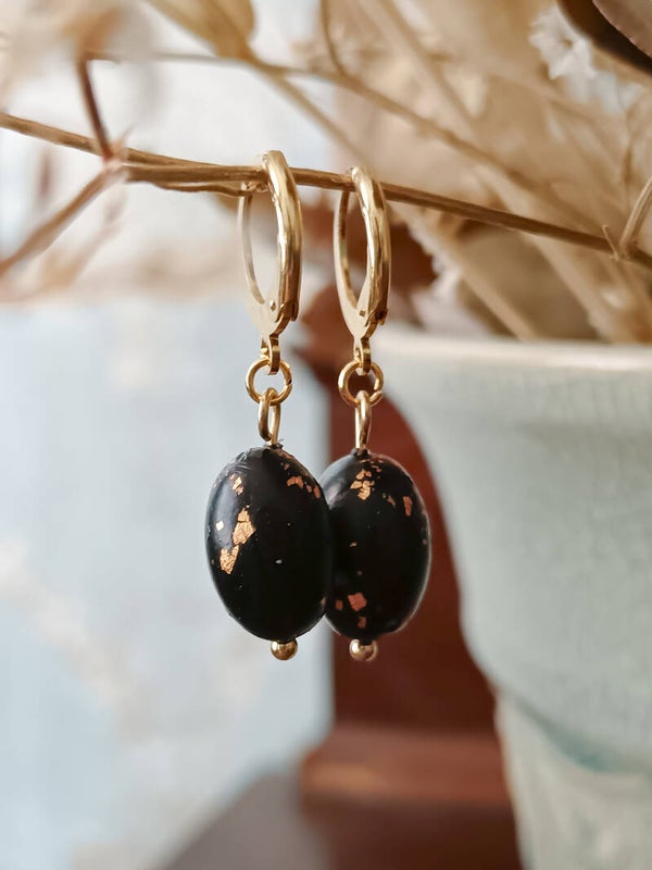 Small oval black and gold earrings