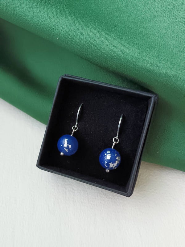 Small blue beaded planet earrings