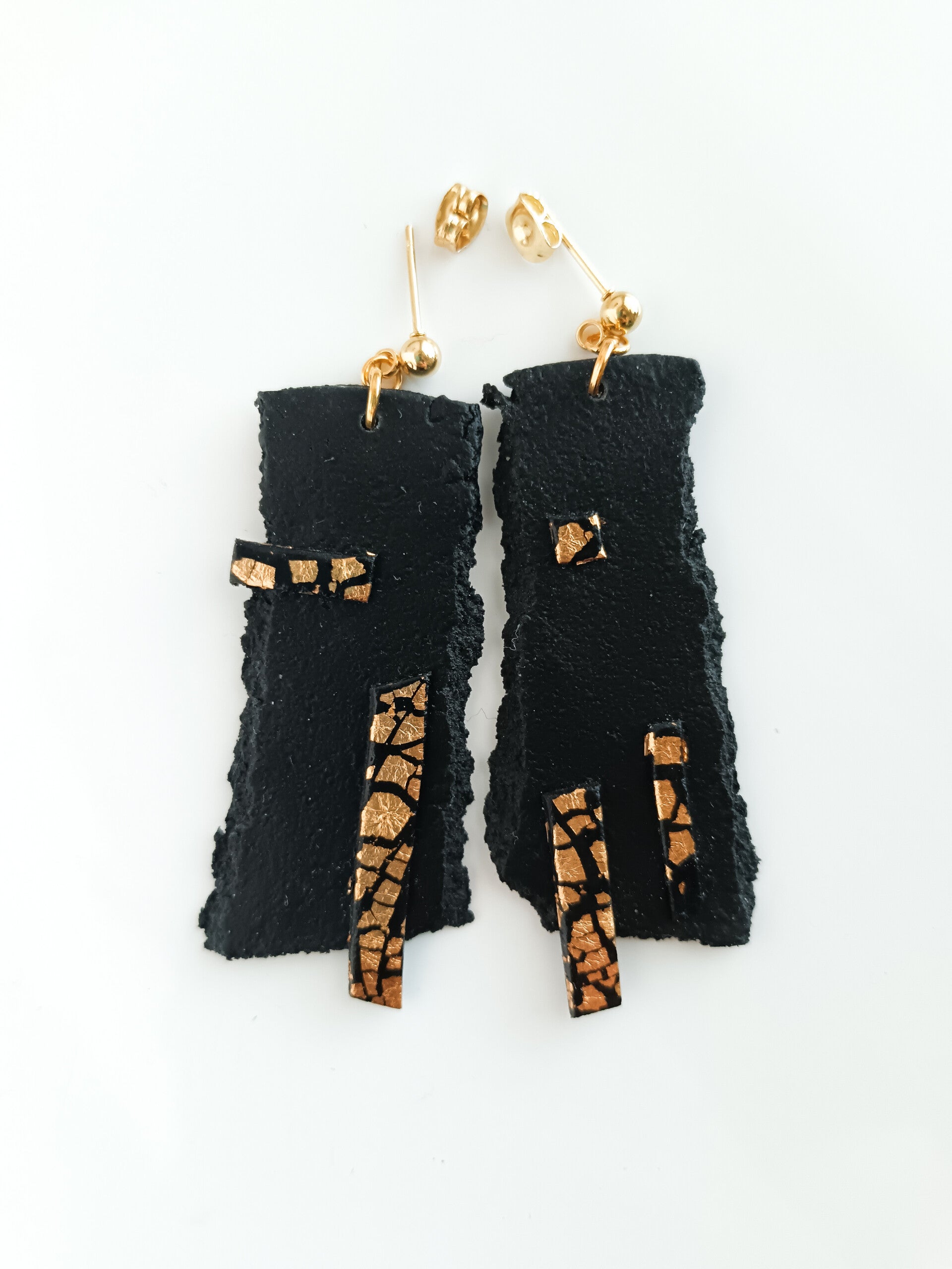 Faux leather artisan statement earrings in black and gold