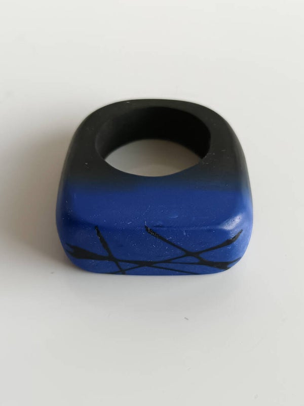 Black and blue ring