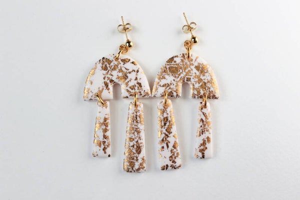 Double pendulum statement earrings in white