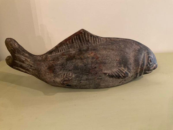 Primitive fish sculpture
