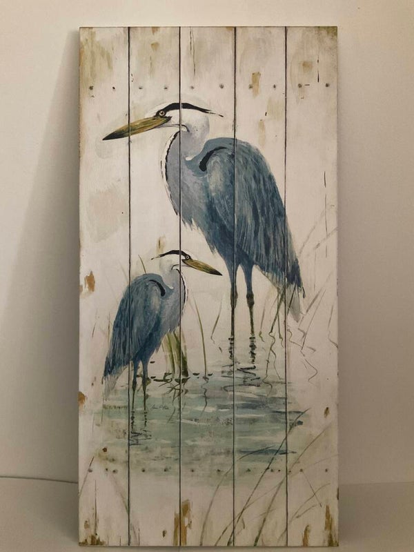 Blue herons on wood