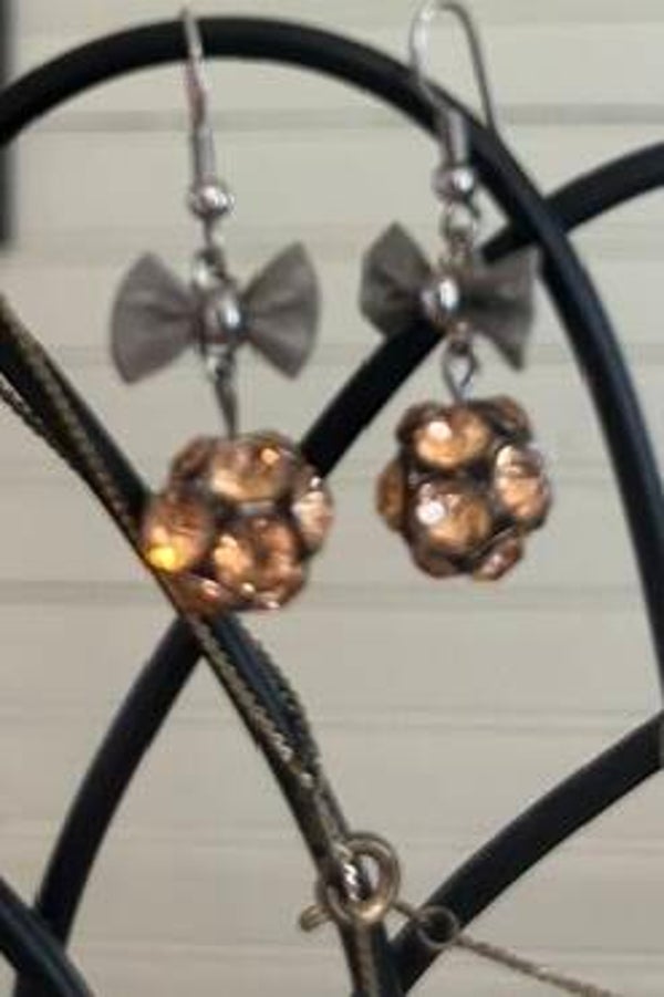 Gold rhinestone earrings with bow