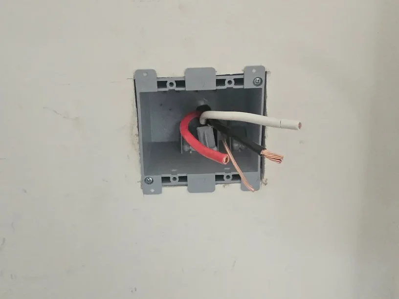 Plug in Tesla Level 2 EV charger outlet setup in garage