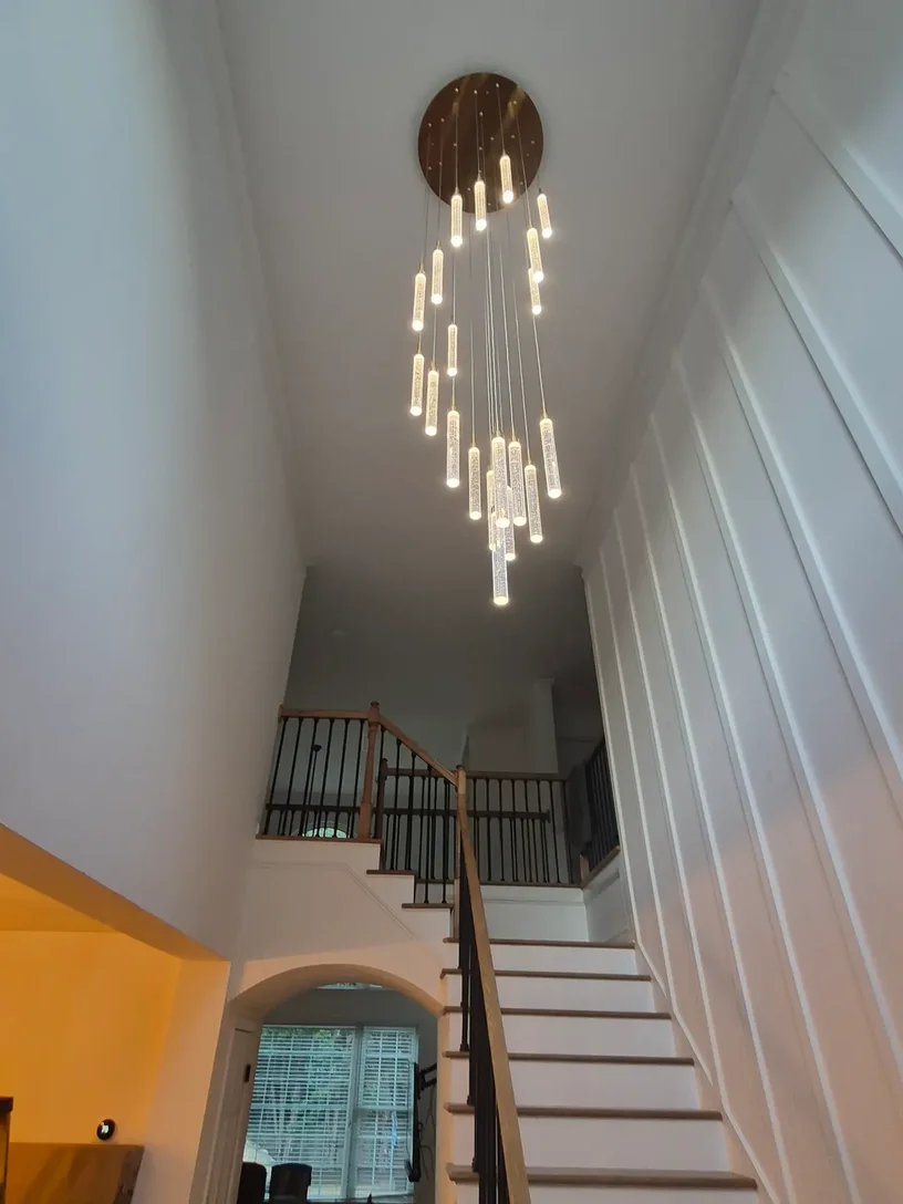 New modern LED chandelier illuminated and tested after installation in Alpharetta Georgia