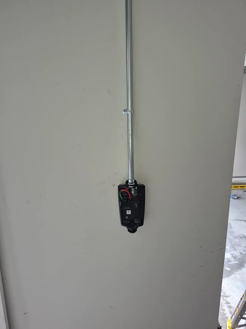 EV charger installed with conduit in Loganville GA by Kais Pro Repairs