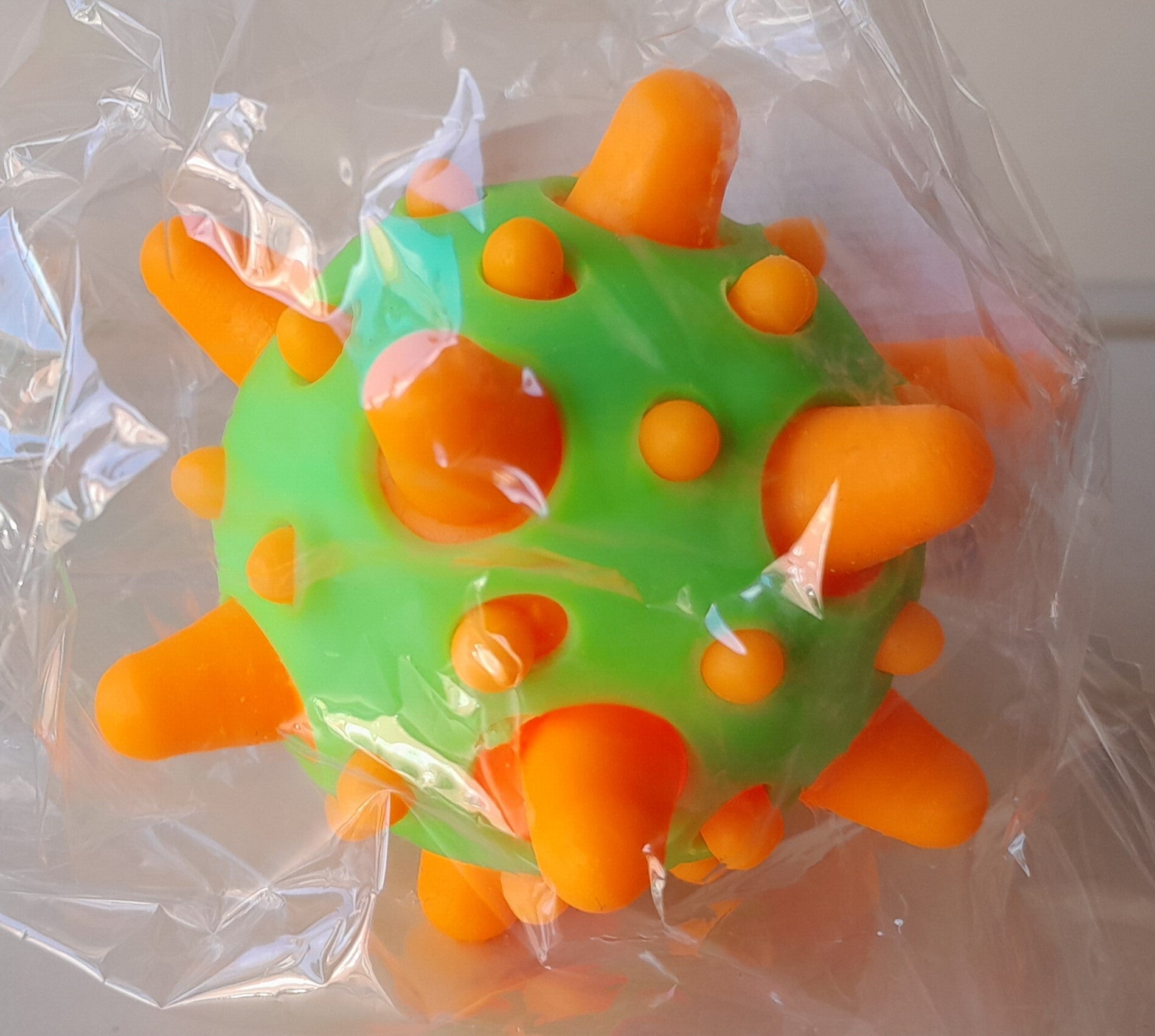 Squeeze Light-Up Meteoor Bal 7cm Groen/Oranje