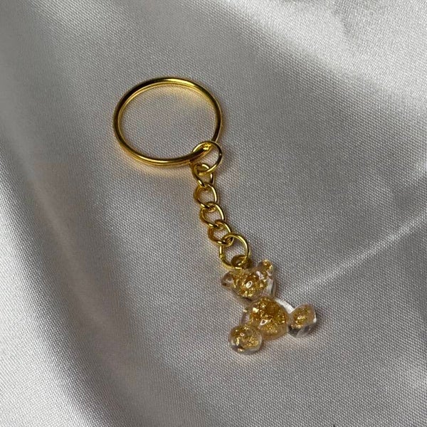 Resinschlüsselanhänger kleiner Teddy mit goldenen Flocken