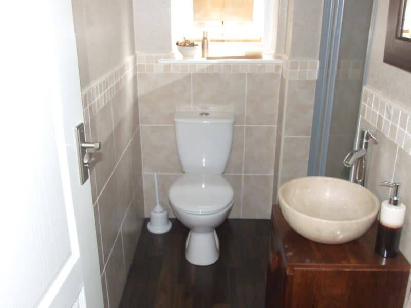 Fully refurbished en-suite with toilet, vanity unit and sit-on bowl, and tiled walls. North Ferriby