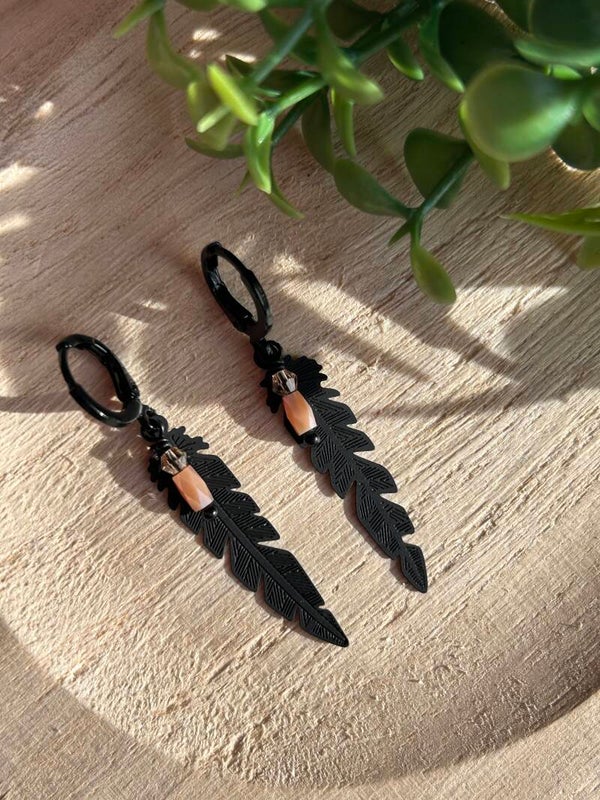 Black feather & pink stone