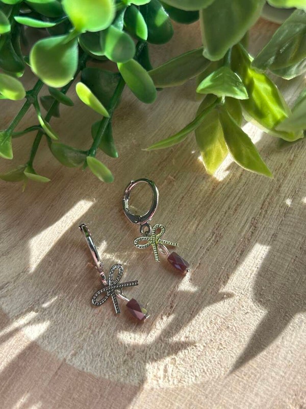 Silver bow & purple stone