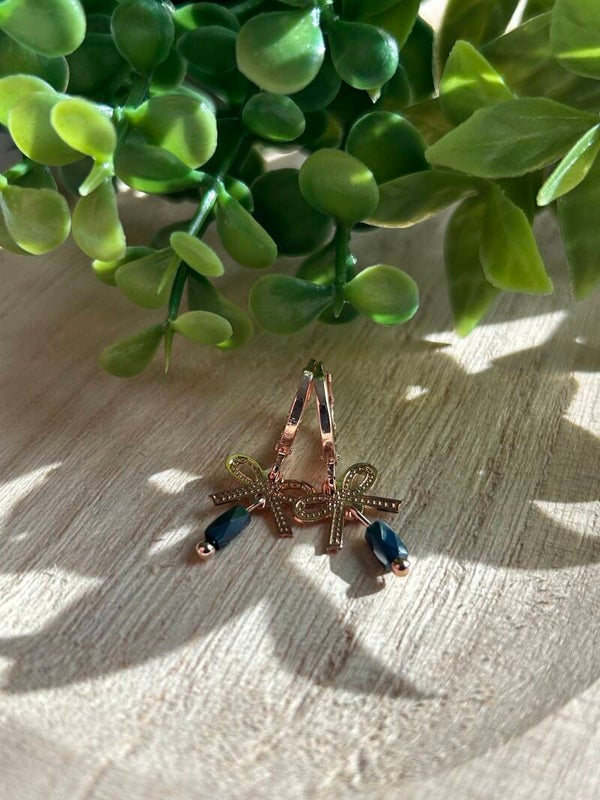 Pink bow & blue stone