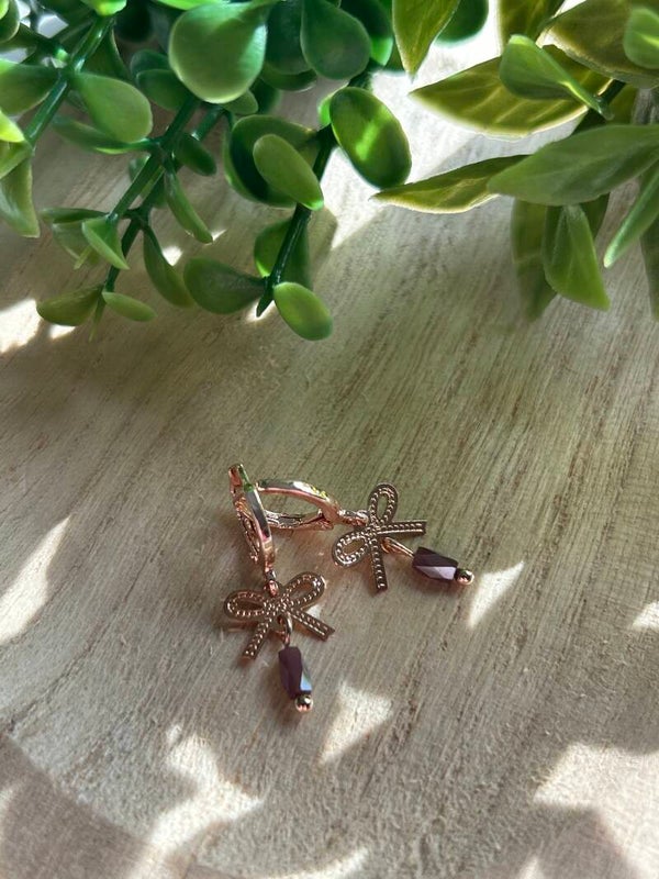 Pink bow & purple stone