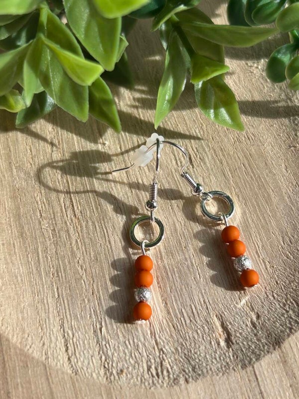 Brown & small silver circle