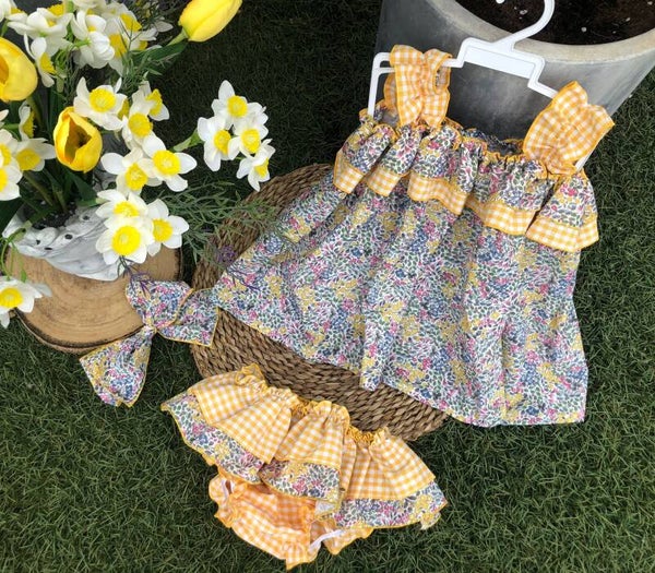 CONJUNTO FLORES VICKY AMARILLO VOLANTE