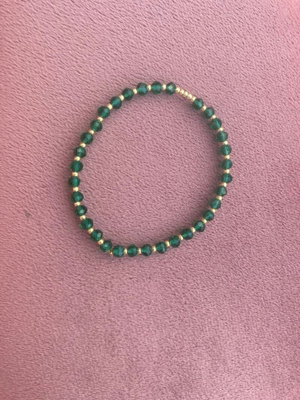 Groen met goudkleurige armband