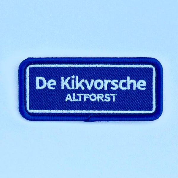 Embleem: De Kikvorsche – Altforst 7 x 3 cm