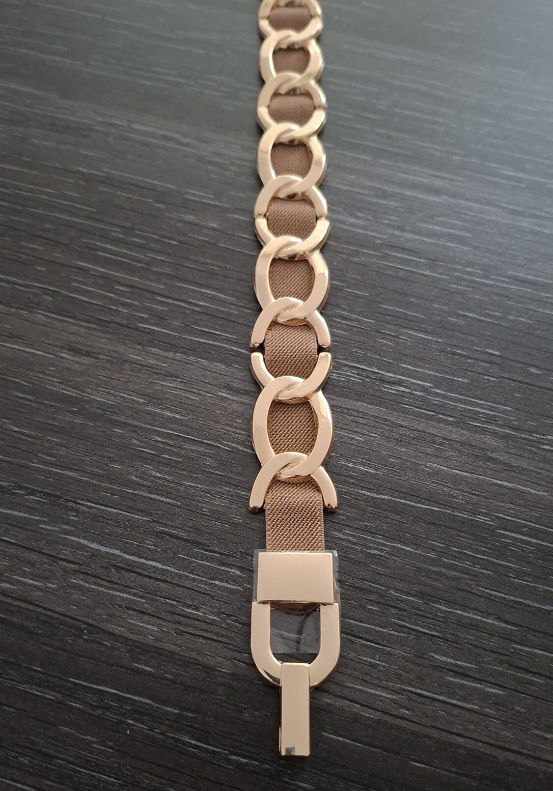 Stretch riem met gouden schakels taupe