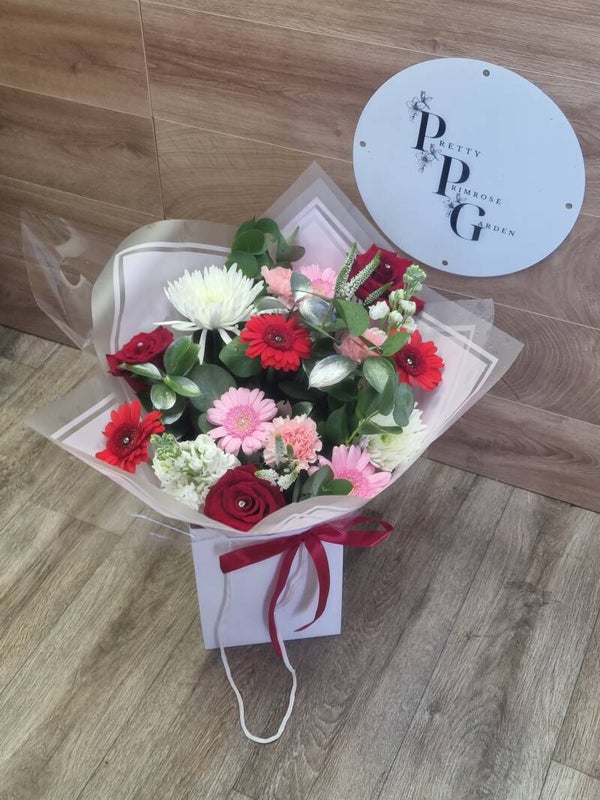 Red Niomi roses with beautiful selection of blooms