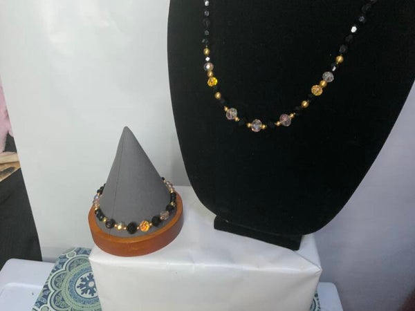 Gold and black necklace with bracelet