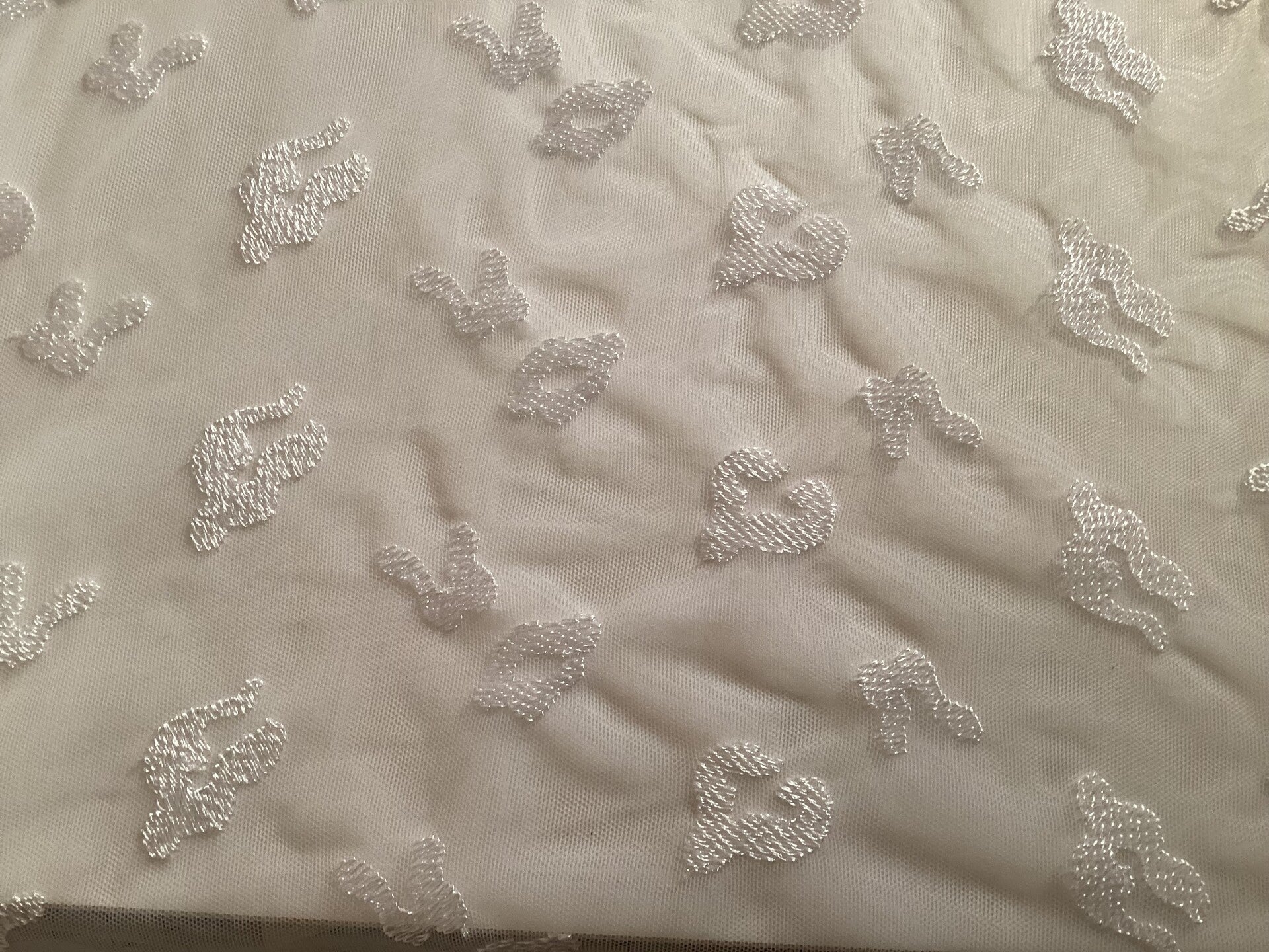 White embroidered abstract