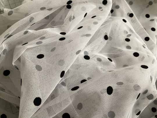 White mesh with black polka dots