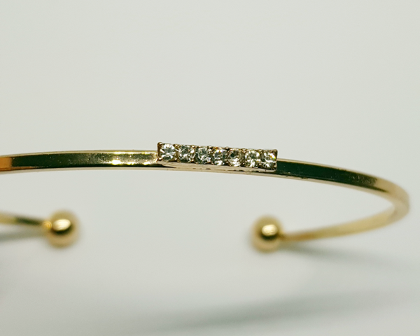 Goudkleurig slavenarmband bling 7 steentjes