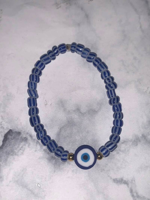 Gestreepte evil eye armband donker blauw