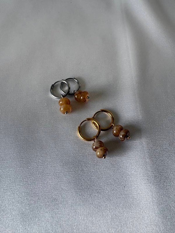 Oorringen natuursteen bruin