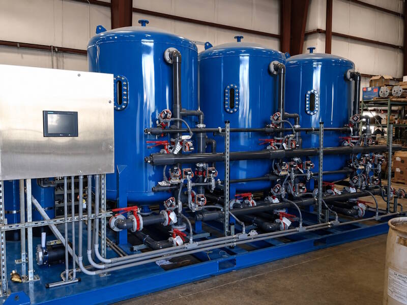 Ion exchange system for sulfate reduction or produced water in oil/gas production