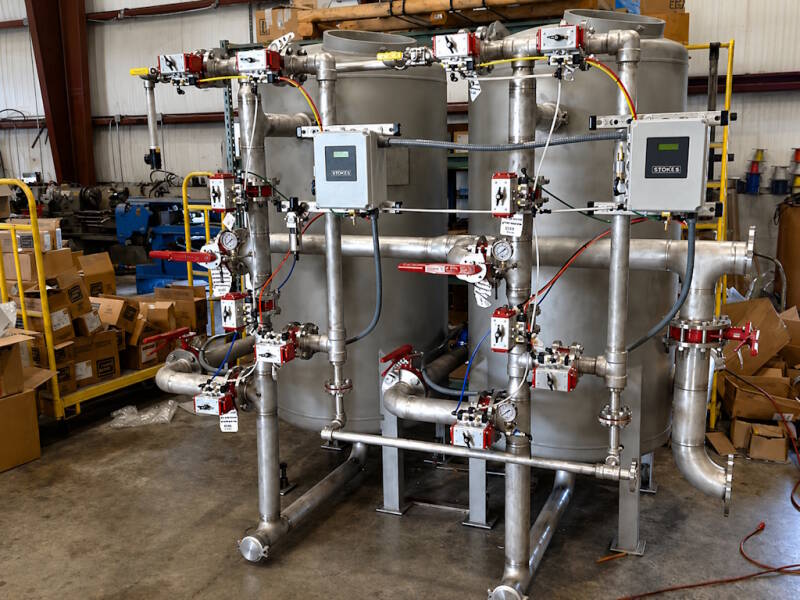 Boiler condensate polisher in a commercial water treatment application