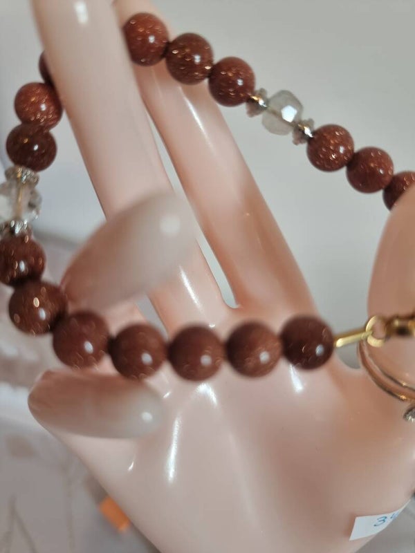 Bracelet pierre de soleil ,decoré quartz blanc.