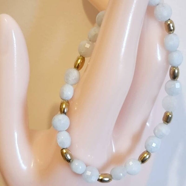 Bracelet pierre aigue-marine marine ,avec huit séparateurs ovales Or .réf MM