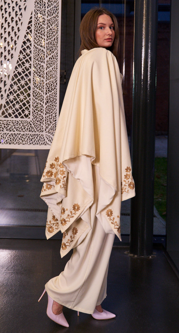 Wool ivory poncho with beige embroidery. Ukrainian traditional ornament