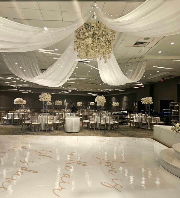 Create a breathtaking focal point with our Ceiling Décor Package, thoughtfully designed to transform your venue and create an unforgettable ambiance. Elegant draping, and stunning overhead accents add depth, warmth, and sophistication, making every celebr