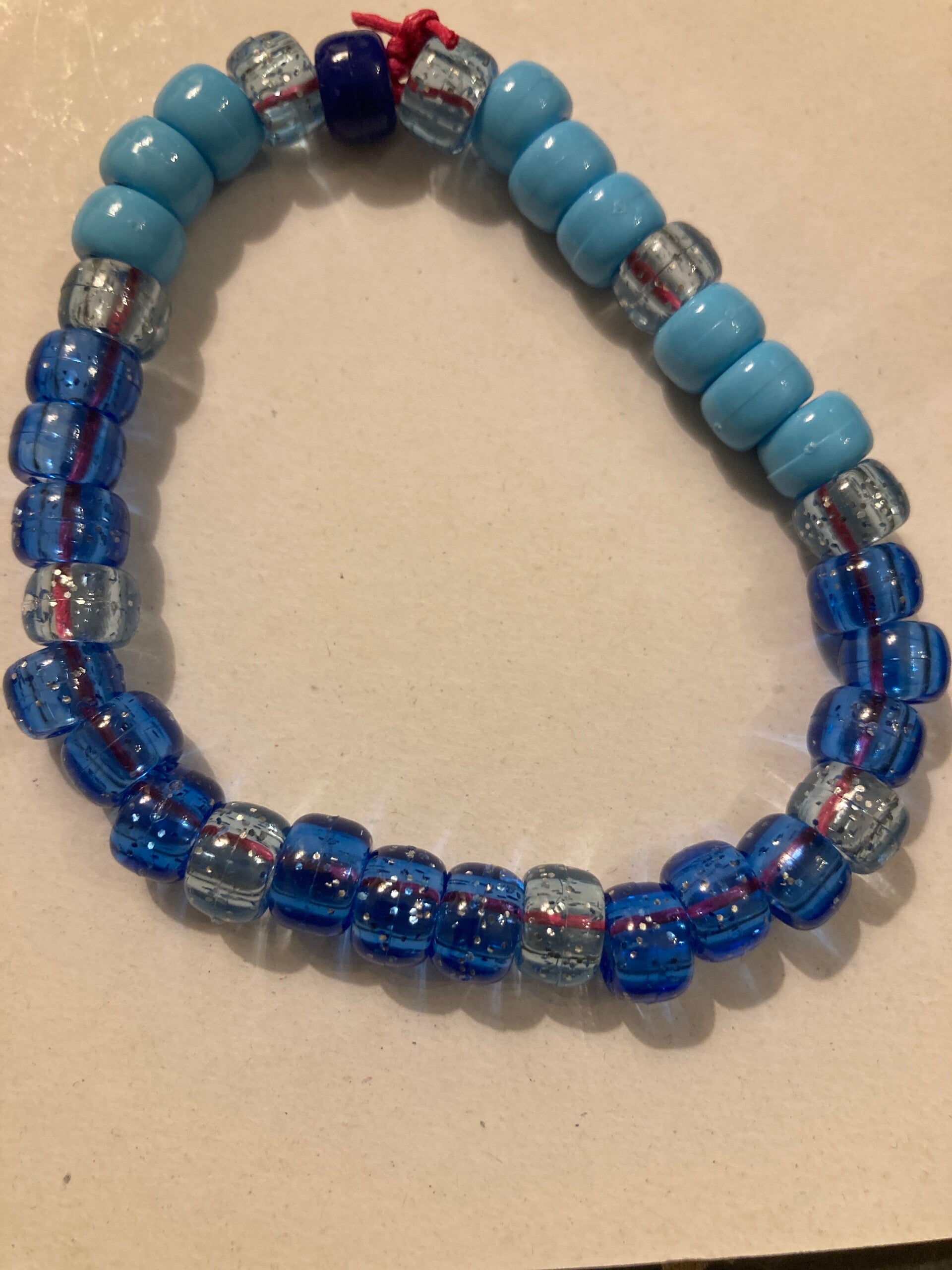 BRACELET Peony Beads On Pink Cord Blue And Clear Speckled And Light Blue
