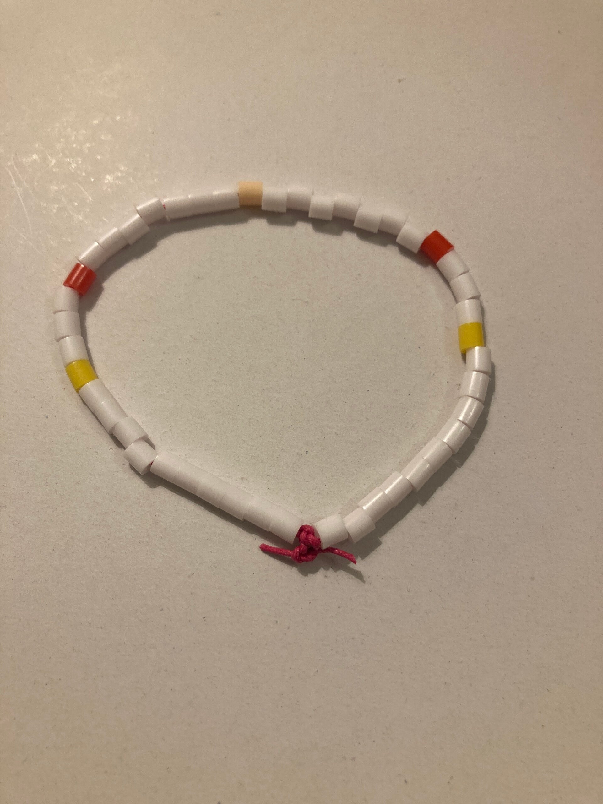BRACELET Red Apricot Yellow White Spacer Beads On Pink Cord