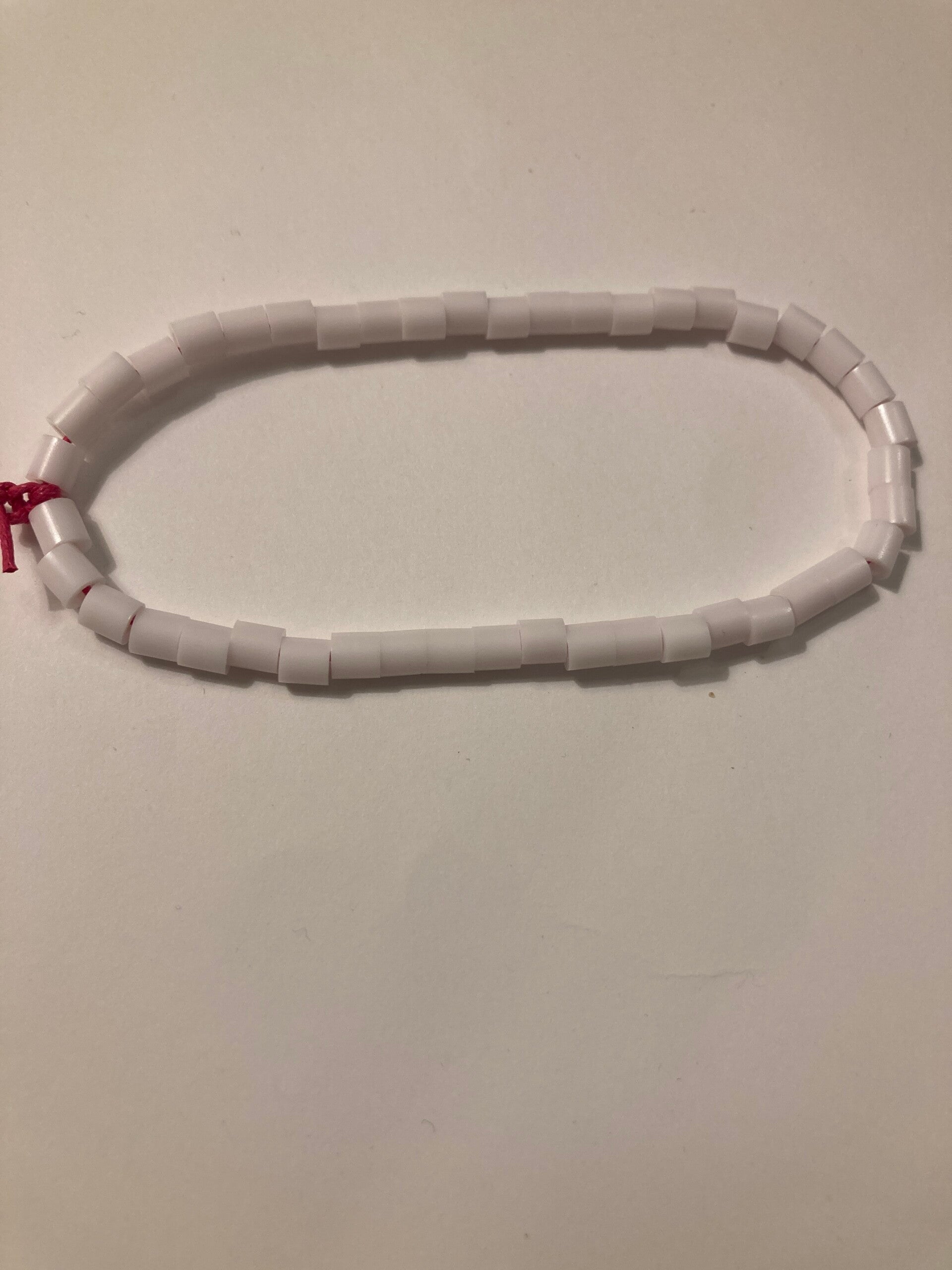 BRACELET White Plate Spacer Beads On Pink Cord