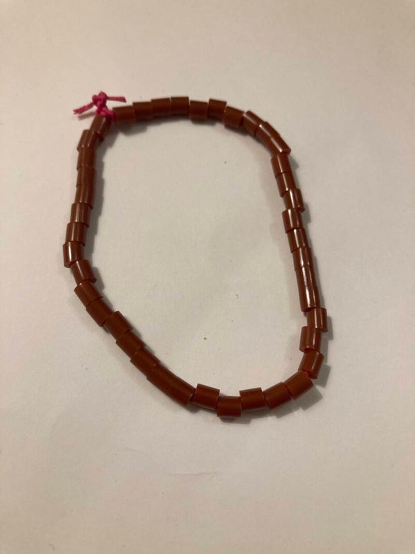 BRACELET Tan Brown Plastic Spacer Beads On Pink Cord