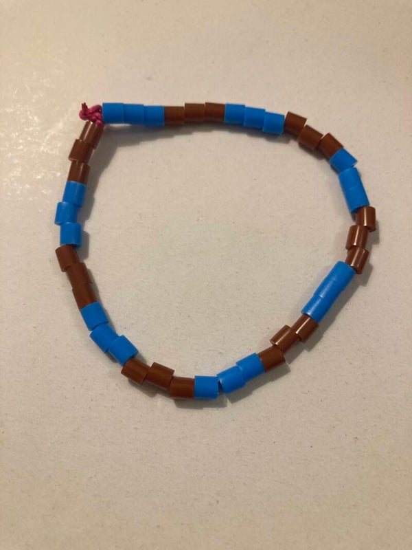 BRACELET Blue And Brown Plastic Beads On Pink Cord