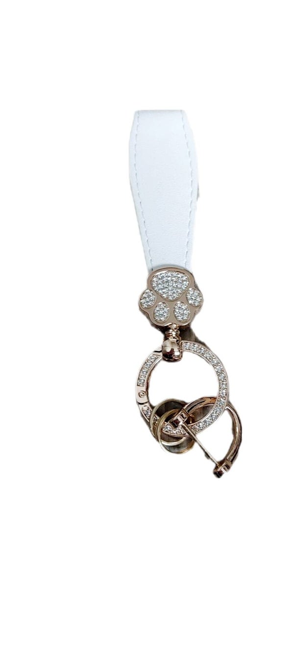 Schlüsselanhänger Pfote weiß/gold