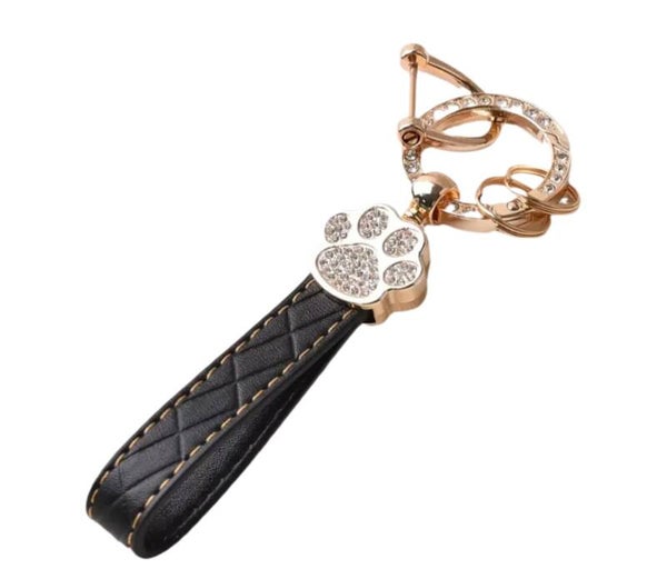 Schlüsselanhänger Pfote schwarz/gold "Steppmuster"