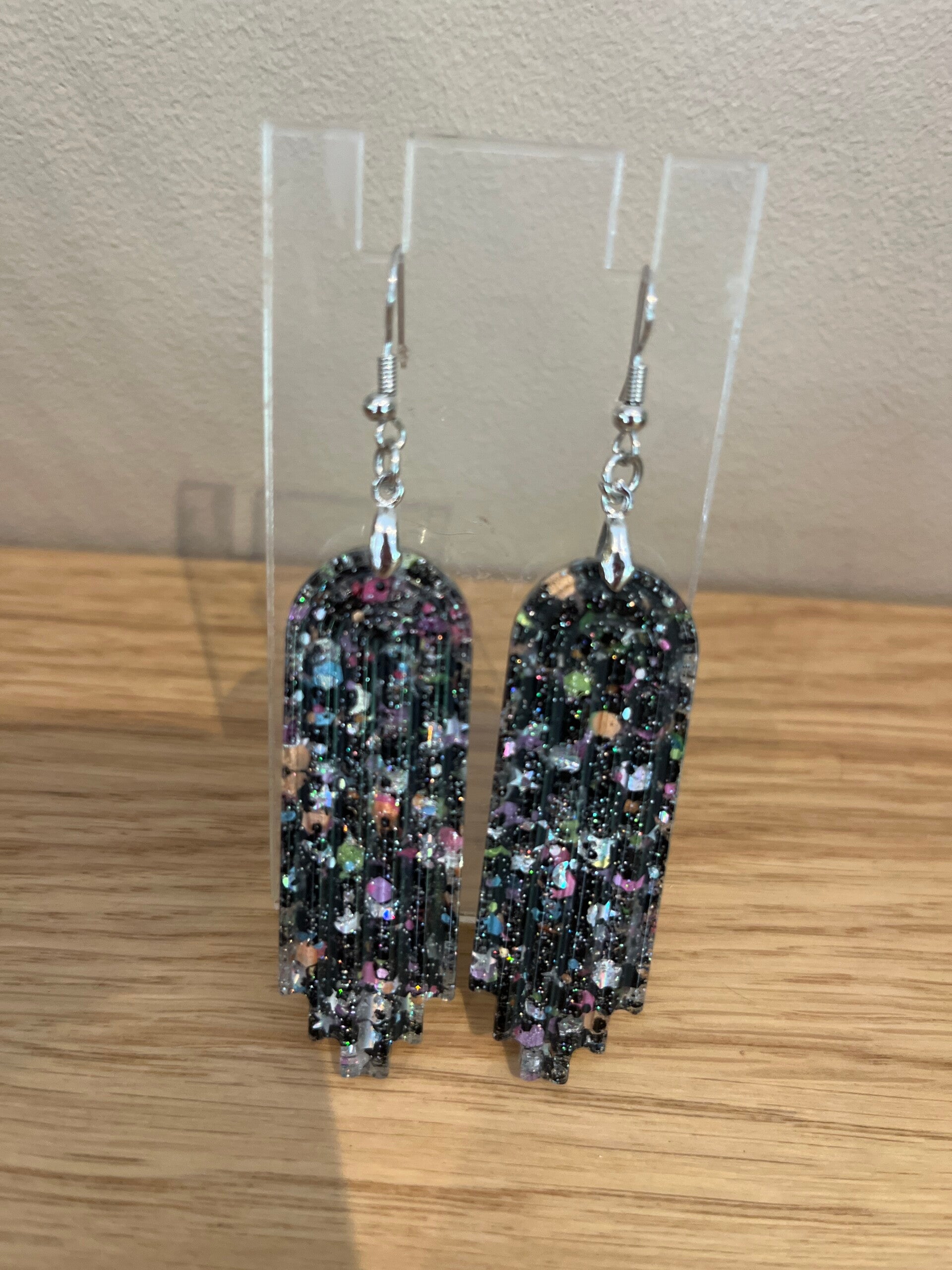 Les boucles d'oreilles Morticia
